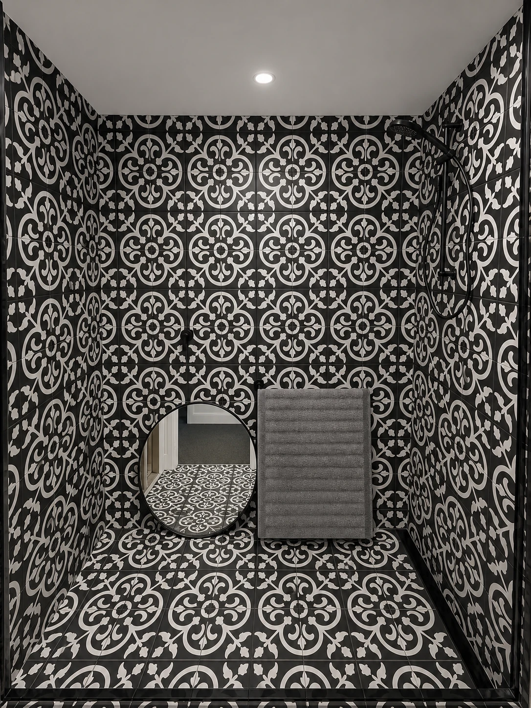 Black and white patterned bathroom tile installation