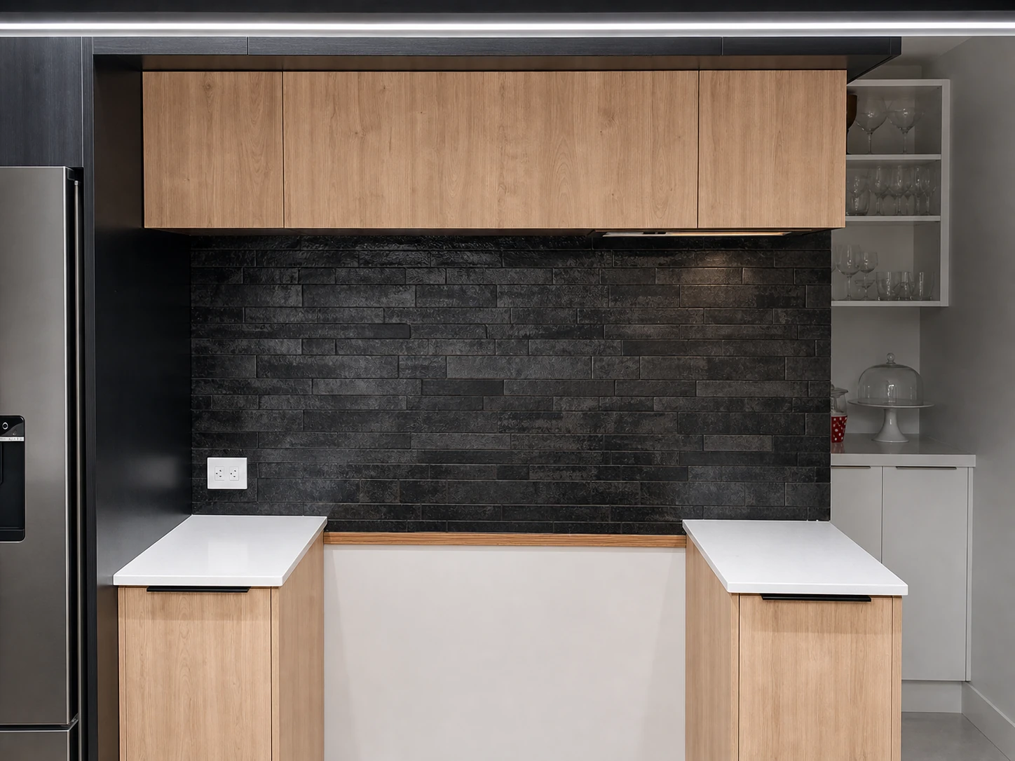 Black stacked kitchen splashback tile installation
