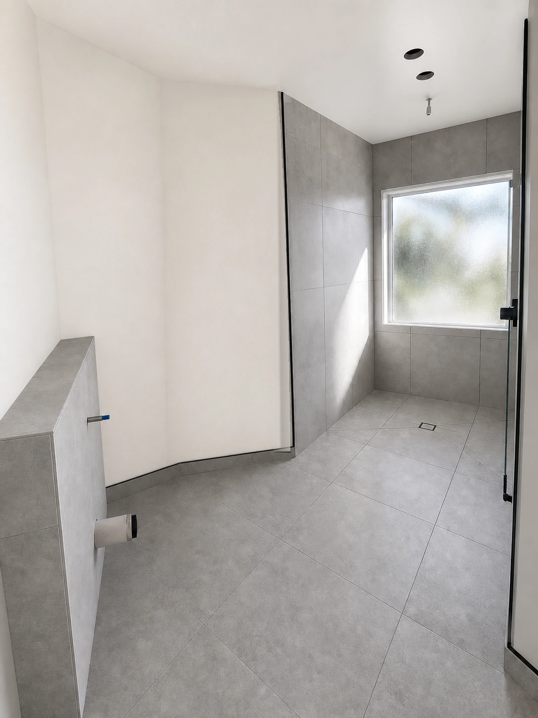 Grey tiled wet area with floor drain and wall tiles